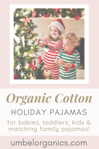 Kids in holiday pajamas decorating tree