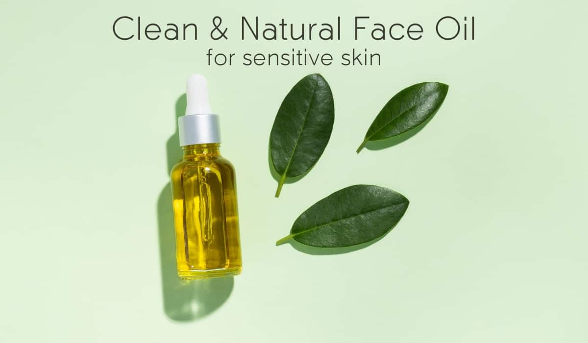 bottle of face oil and green leaves