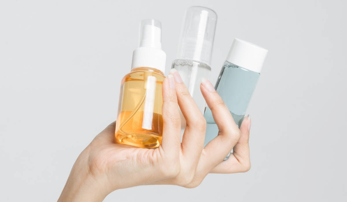 hand with skincare products